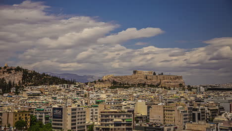 Acropolis-of-Athens-standing-above-cityscape,-time-lapse-view