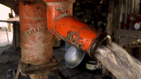 Fetching-fresh-groundwater-from-deep-well-hand-water-pump