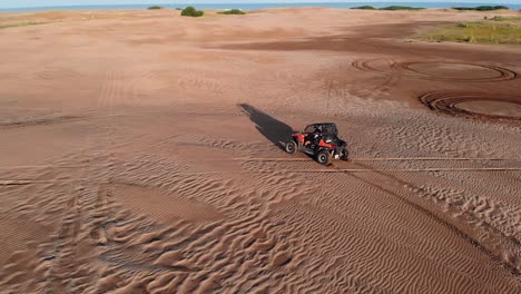 shot-of-a-dune-buggy-drifting-in-the-middle-of-the-desert,-normal-speed-version