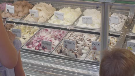 Mother-And-Child-In-Front-Of-Ice-Cream-Shop-Display