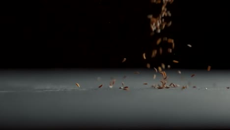 Cumin-falls-on-a-table-in-slow-motion