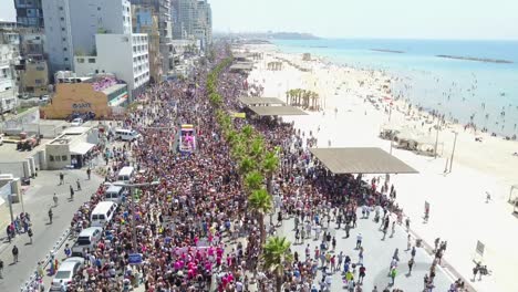 Drone-shot-of-the-crowded-boardwalk-during-the-Tel-Aviv-Pride-Parade