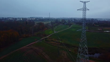 Power-line-pillars-in-aerial-view-on-a-gloomy-autumn-day