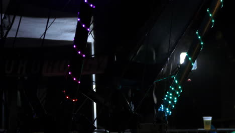 Person-bounces-on-trampoline-in-low-light