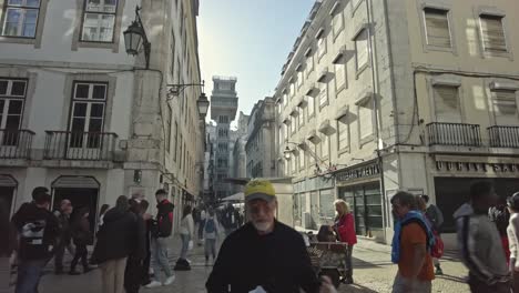 Bustling-street-scene-near-the-Santa-Justa-Lift-in-Lisbon's-Chiado-district,-daytime