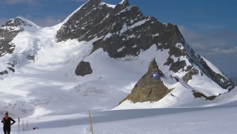 outside-view-of-the-Jungfraujoch-Sphinx-Observatory-on-top-of-europe,-Switzerland-snow-covered-mountain-scenery