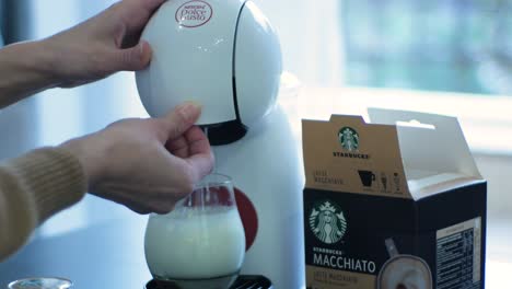 Dolce-Gusto-coffee-machine-making-Starbucks-Macchiato-coffee-with-milk