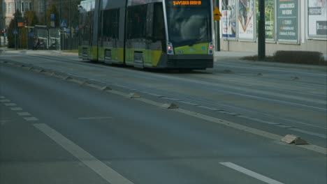 Tram-driving-down-Main-Street-in-Olsztyn,-Poland