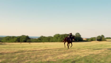 Horse-loping-in-Lozenec,-Bulgaria,-ride-by-a-woman-in-grass-field