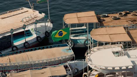 boat-for-carrying-tourist-with-Brazilian-flag-in-Aswan-Dam-and-Lake-Nasser,-Egypt