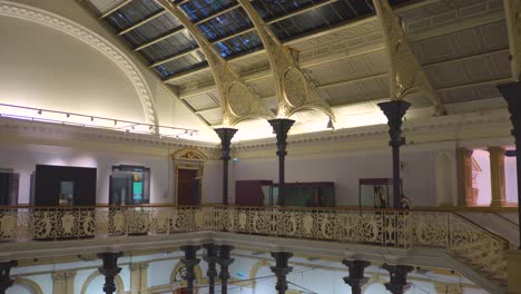 Tilt-shot-of-the-interior-of-the-main-hall-of-the-National-Museum-of-Ireland,-Archeology