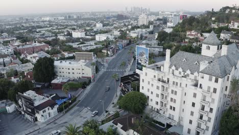 Aerial-drone-video-flying-over-Sunset-Boulevard-alongside-the-iconic-Chateau-Marmont-hotel-in-Los-Angeles