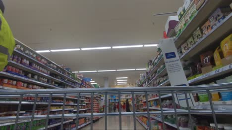POV-From-Inside-Trolly-Going-Down-Canned-Veg-Aisle-In-Tescos