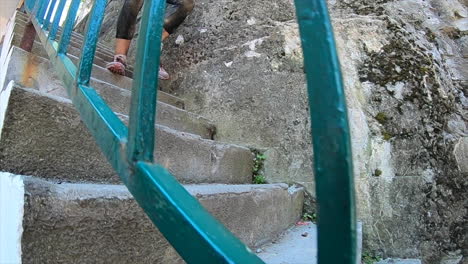 Obstacle-racing-athlete-running-down-stairs-at-an-obstacle-course-race