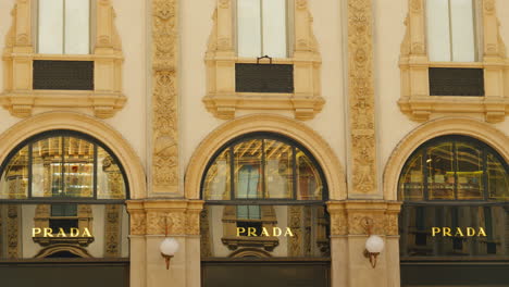 Elegant-Prada-store-facade-in-Milan,-traditional-architecture-and-luxury-branding