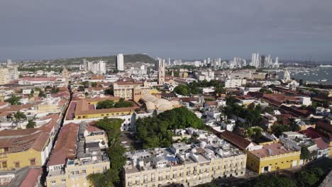Aerial-forward-over-city-skyline-Cartagena-in-Colombia-cloudy-sky