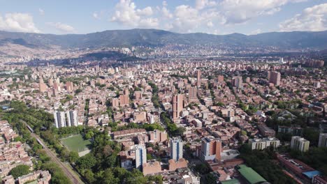 Aerial-panoramic-establishing-orbit-of-Medellin-Colombia-dense-urban-city