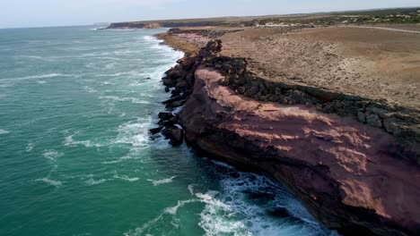 Sea-Waves-Crashing-Against-The-Rocky-Coastline-And-Cliffs-Of-Talia-In-South-Australia
