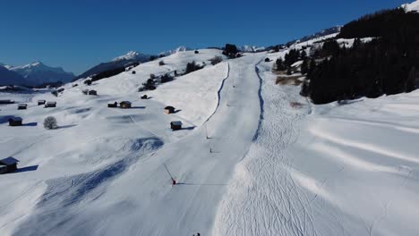 Easy-ski-piste-during-winter-season-in-Austria,-aerial