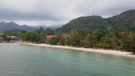 Aerial-View-Along-Kai-Bae-Beach-Coastline-With-Tropical-Forest-Landscape-In-Background
