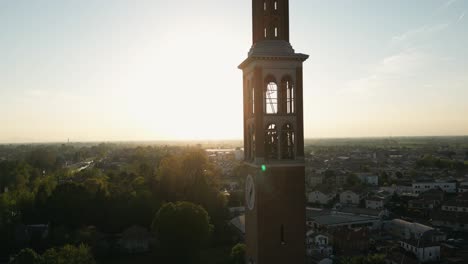Sun-Shining-Through-The-Saint-Nicholas-Catholic-Church-Bell-Tower-in-Mira,-Italy