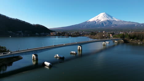 Vehicles-Driving-Through-The-Bridge-Spanning-The-Lake-Kawaguchi-With-Mt