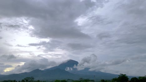Clouds-flowing-over-massive-mountain-in-Indonesia,-time-lapse-view