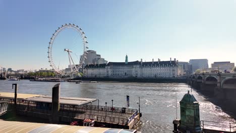 Sunny-Morning-day-at-Westminster-Embankment-Pier-with-views-of-the-London-Eye,-County-Hall-And-River-Thames
