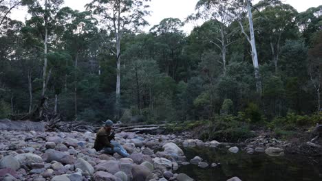 A-bushman-smoking-a-pipe-by-a-river-in-the-Australian-bush