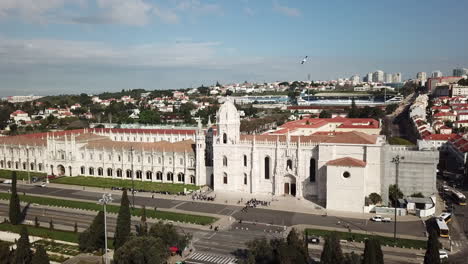 Lisbon,-Belem,-Jeronimos-Monastery's-drone-footage-from-a-distance,-camera-slides-from-left-towards-right