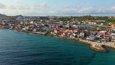 Sunset-golden-hour-light-shines-on-coastal-dutch-buildings-in-Willemstad-Curacao