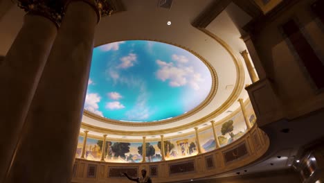 Vaulted-ceilings,-columns-and-a-statue-at-the-Forum-Shops-luxury-mall,-Las-Vegas