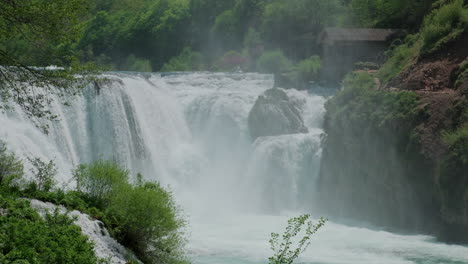 A-waterfall-of-a-pure-wild-river-located-in-a-green-rainforest