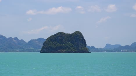 Driving-past-beautiful-rock-island-in-Thai-Andaman-Sea