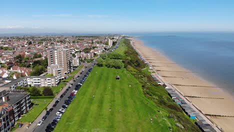 Flying-out-reveal-shot-of-Frinton-Beach-in-Essex,-UK