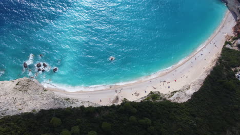 A-bird's-eye-view-down-the-sheer-cliffs-of-Porto-Katsiki-beach-in-Greece