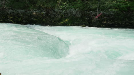 A-waterfall-of-a-pure-wild-river-located-in-a-green-rainforest