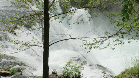 A-waterfall-of-a-pure-wild-river-located-in-a-green-rainforest