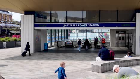 People-Walking-To-The-Entrance-Of-Battersea-Power-Station-Underground-In-London,-UK