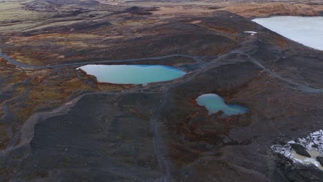 Turquoise-glacial-lakes-in-black-volcanic-landscape-in-Iceland