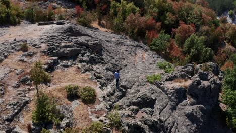 Man-Walking-At-Thracian-Sanctuary-In-Harman-Kaya,-Rhodope-Mountain,-Bulgaria