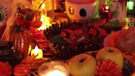 Day-of-the-dead-offerings-on-the-altar,-sugars-skulls-and-food