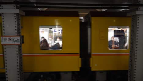 train-luggage-in-japan,-subway-station-in-japan,-subway-bagons