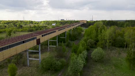 Long-tunnel-bridge-connecting-huge-factory-in-a-far-distance-in-eastern-European-or-Russian-looking-like-location