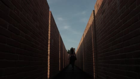 Woman-Walking-Between-The-Defensive-Walls-At-Cittadella-In-Veneto,-Italy