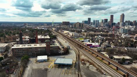 Cityscape-With-Buildings,-Railroads-And-Bridges-In-Atlanta,-Georgia---Aerial-Drone-Shot