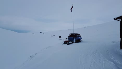 Push-Past-Lone-Building-Toward-Snowcat