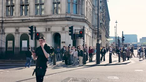 Crowd-of-people-walking-crossing-Parliament-Street-In-Westminster-On-Sunny-Morning