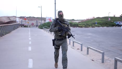 An-Israeli-IDF-soldier-jogs-to-ensure-security-in-every-corner-of-a-city-in-Israeli-territory