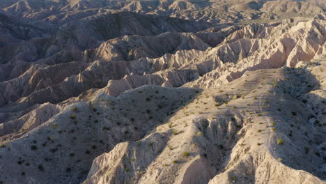 -Expansive-Badlands-with-Majestic-Mountain-Formation,-Aerial-View